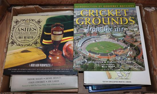 A collection of cricket books and original Churchill newspapers